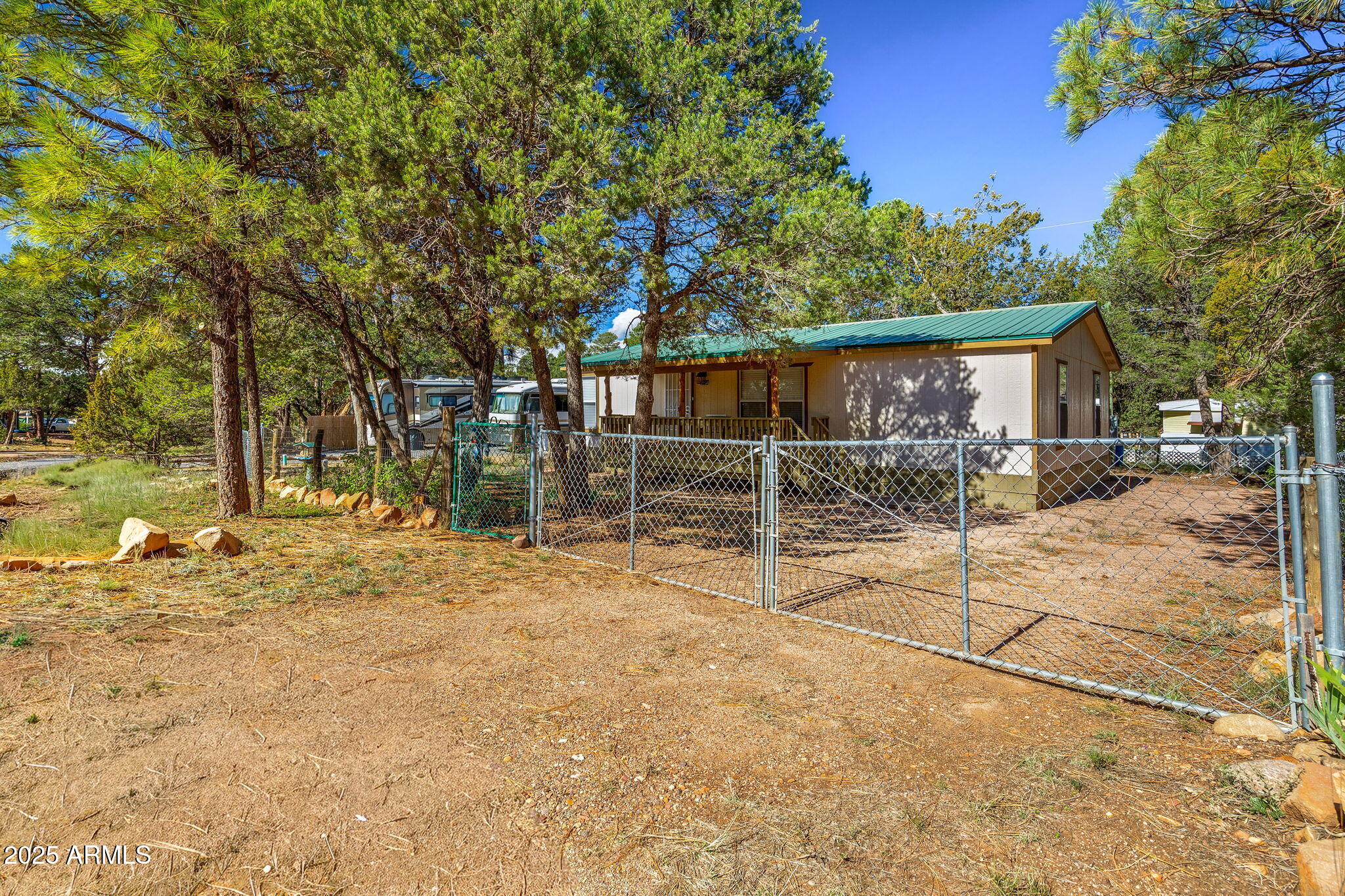 2064 Pinewood Drive Overgaard, AZ 85933 - Photo 2 of 33 a view of a house with a tree in the background