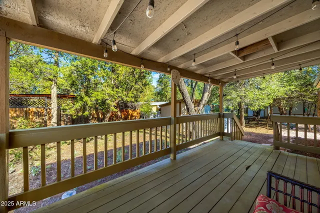 a view of a balcony with wooden floor