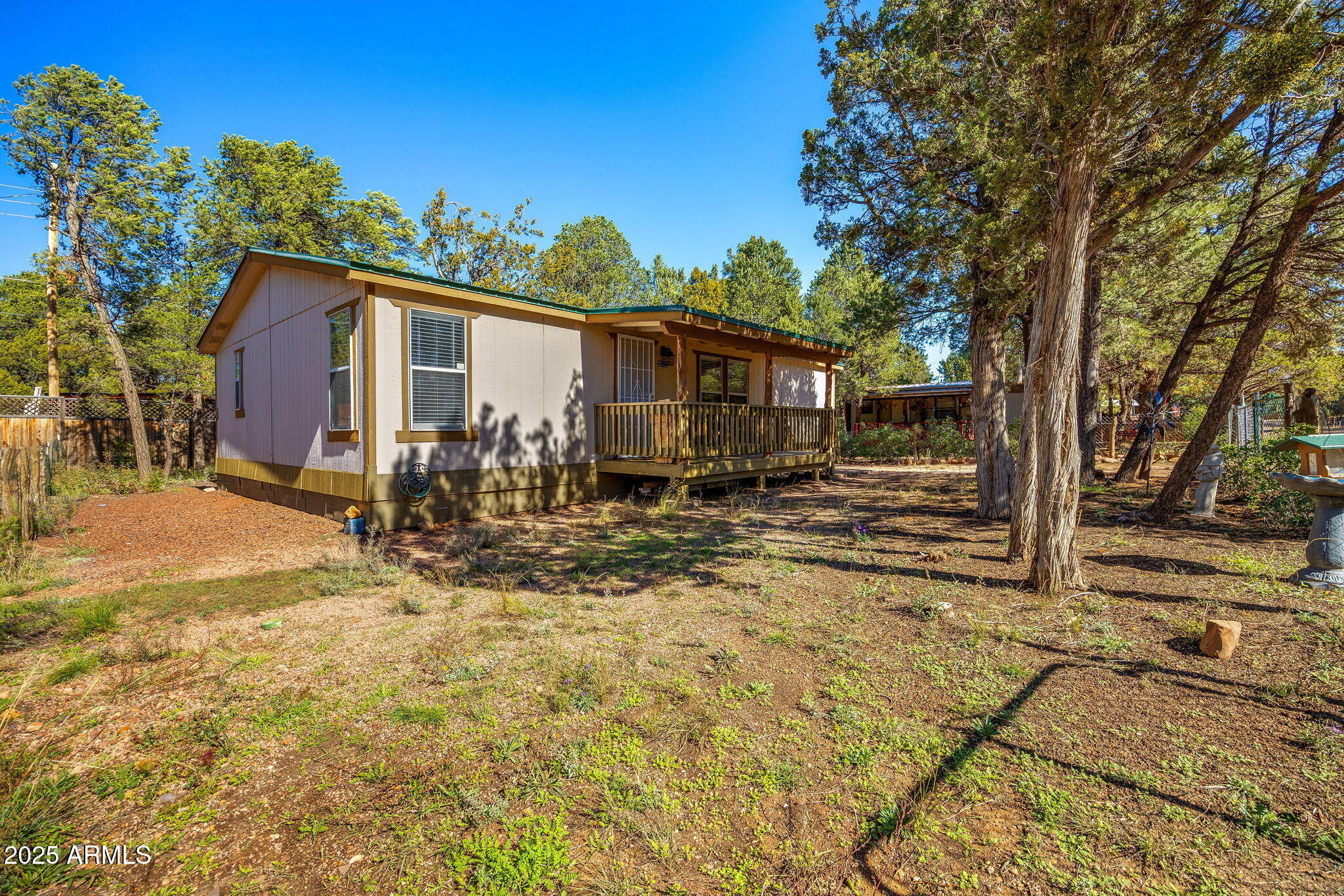 2064 Pinewood Drive Overgaard, AZ 85933 - Photo 26 of 33 a view of a house with a yard covered in snow