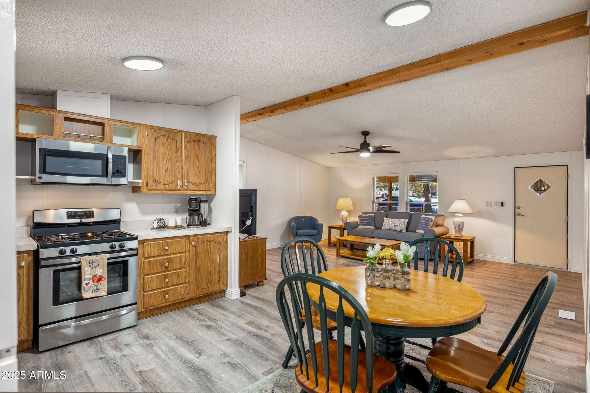 2064 Pinewood Drive Overgaard, AZ 85933 - Photo 8 of 33 a view of a dining room with furniture and wooden floor