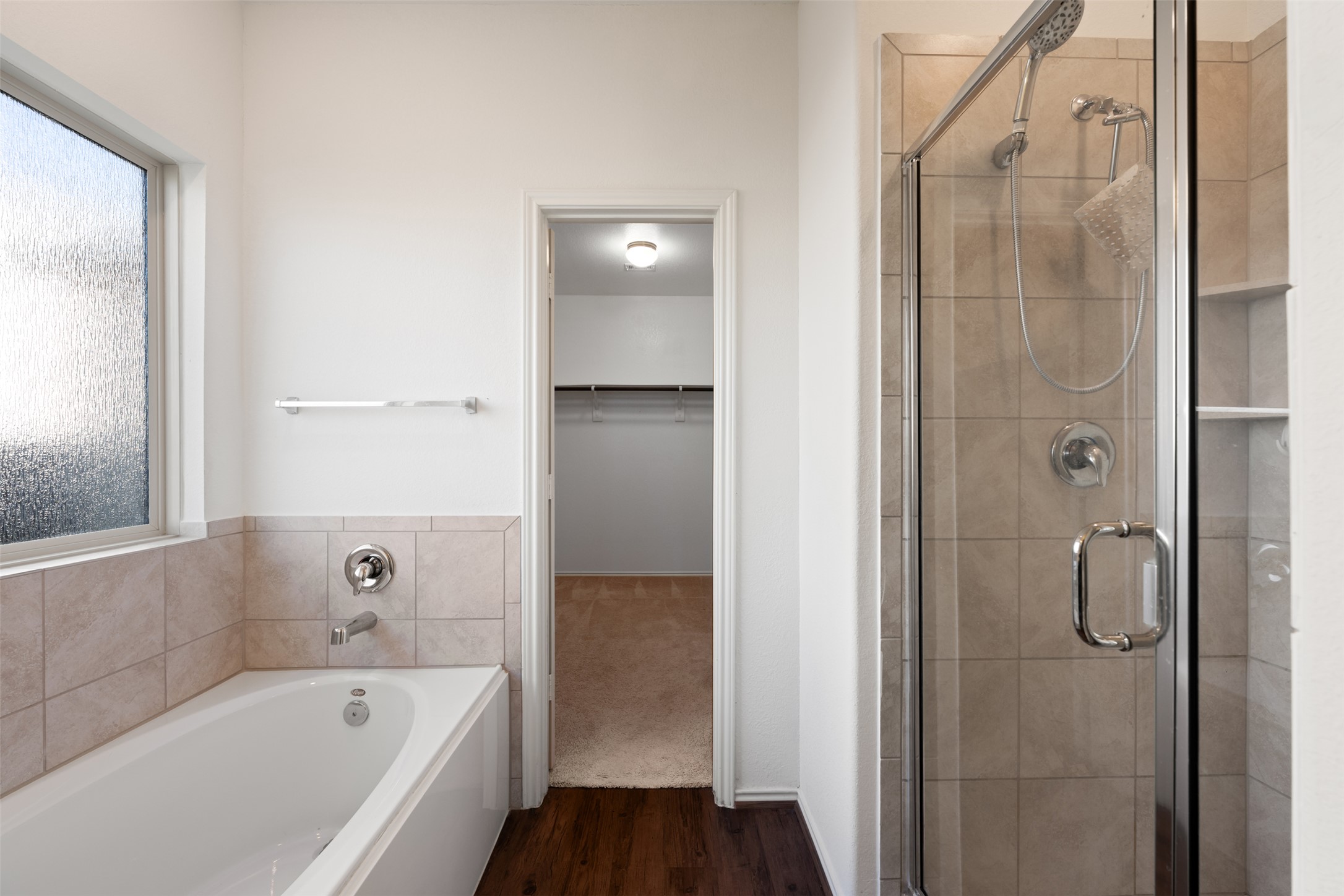 160 Copper Lane Kyle, TX 78640 - Photo 26 of 40 a bathroom with a bathtub and shower