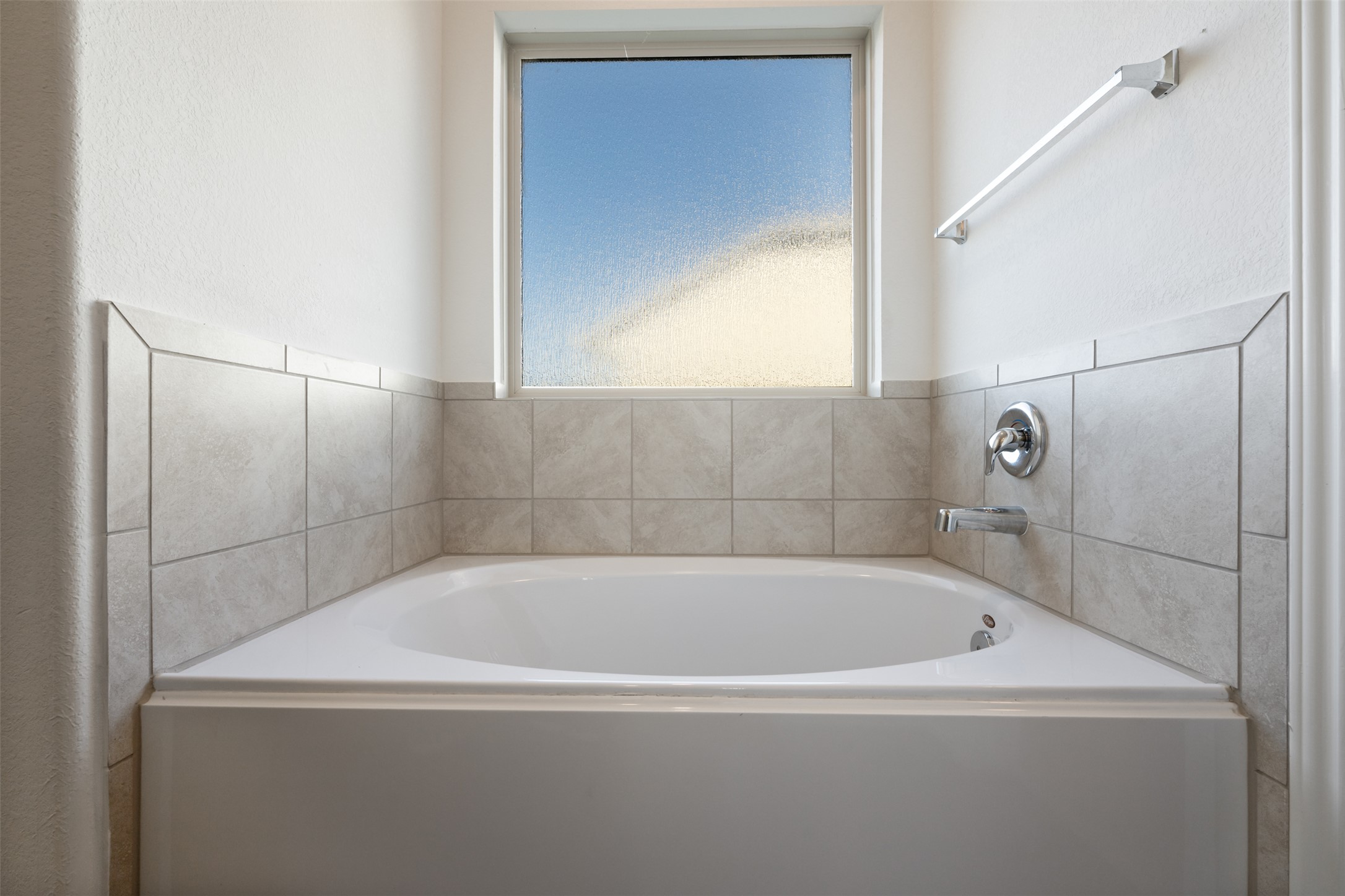 160 Copper Lane Kyle, TX 78640 - Photo 28 of 40 a white bath tub sitting next to a window