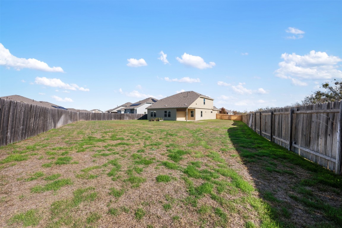 160 Copper Lane Kyle, TX 78640 - Photo 40 of 40 a view of a garden with wooden fence