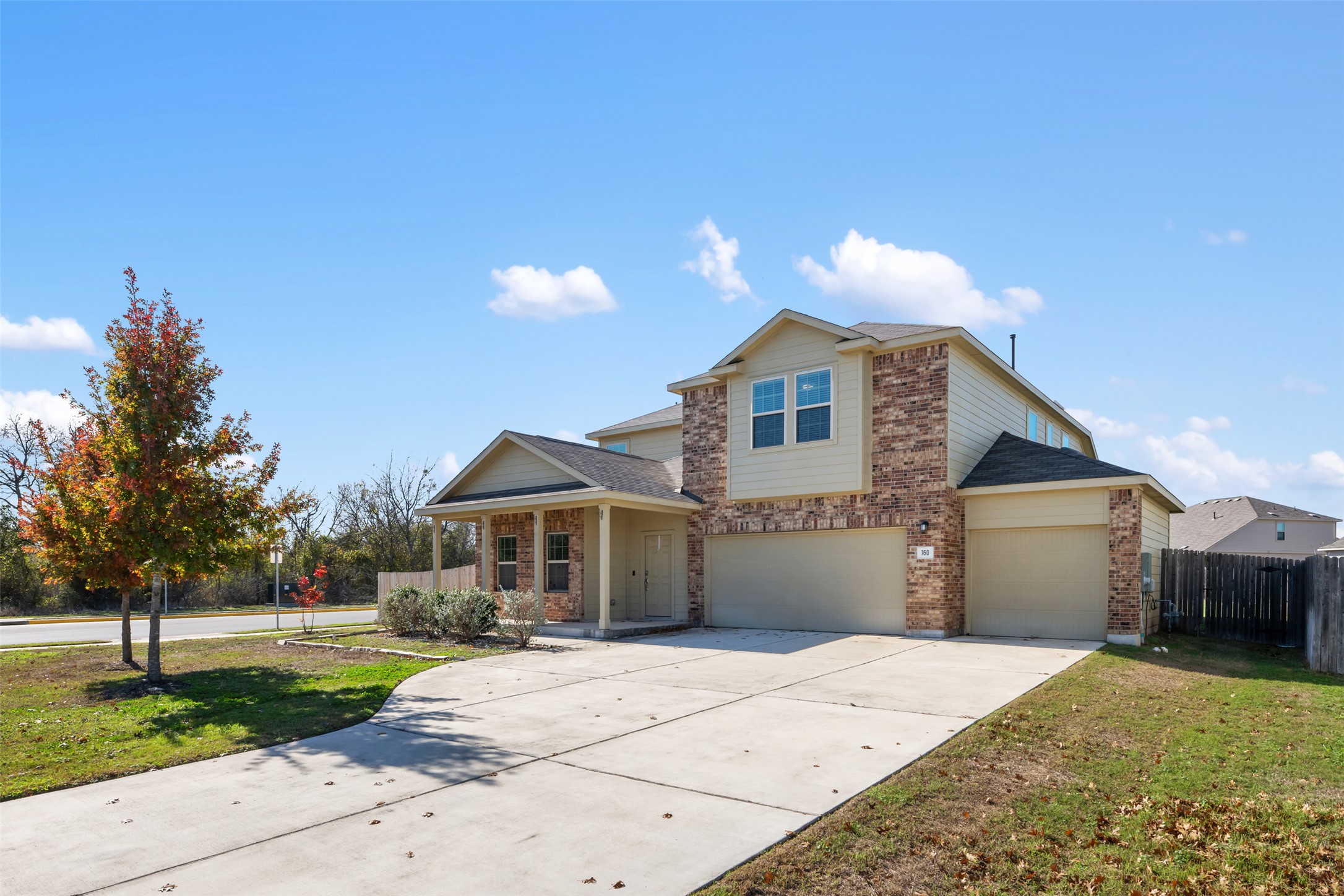 160 Copper Lane Kyle, TX 78640 - Photo 4 of 40 a front view of a house with a yard and garage