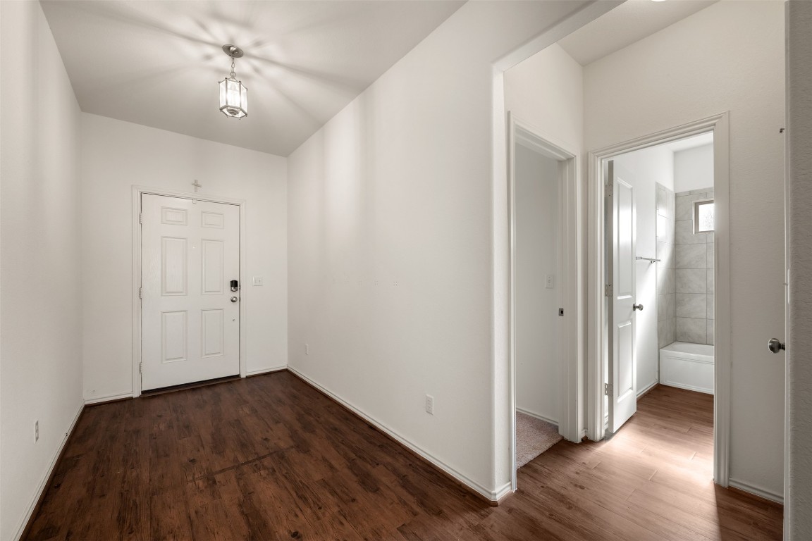 160 Copper Lane Kyle, TX 78640 - Photo 6 of 40 a view of empty room with wooden floor