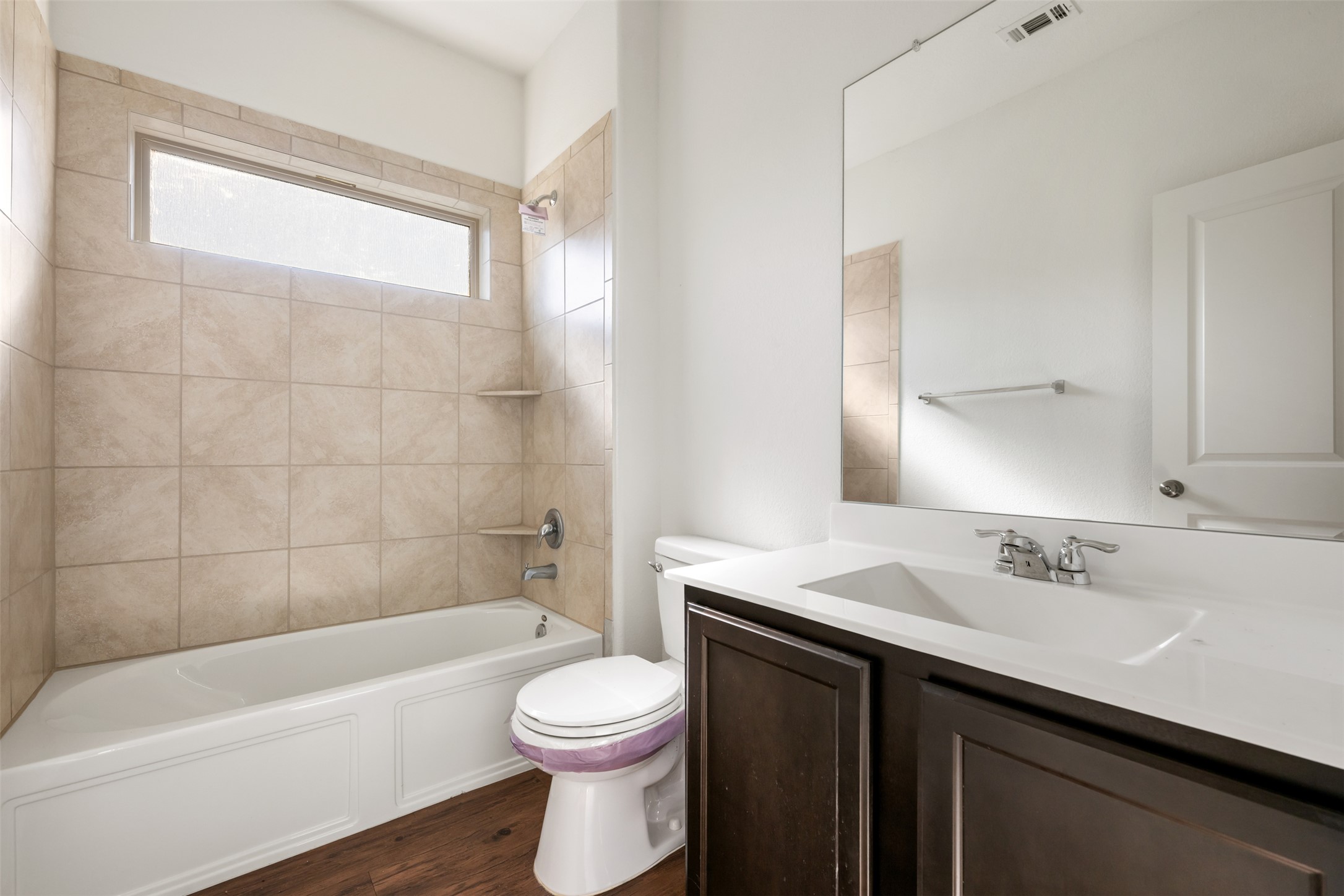 160 Copper Lane Kyle, TX 78640 - Photo 7 of 40 a bathroom with a sink a toilet a bathtub and shower