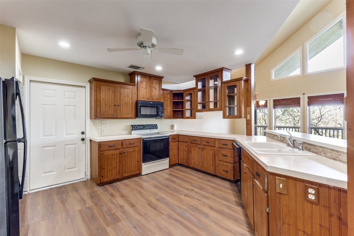 106 Redbud Drive Spicewood, TX 78669 - Photo 12 of 35 a large kitchen with stainless steel appliances lots of counter top space