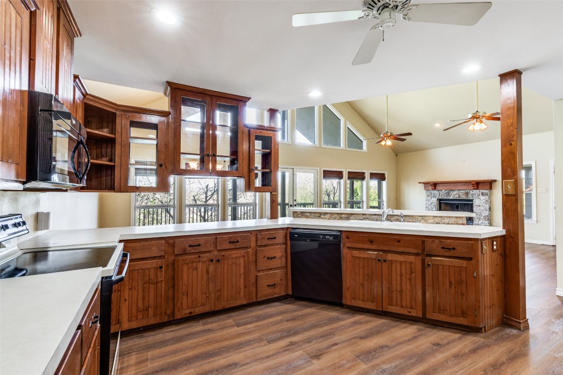 106 Redbud Drive Spicewood, TX 78669 - Photo 13 of 35 a kitchen with a sink cabinets and wooden floor