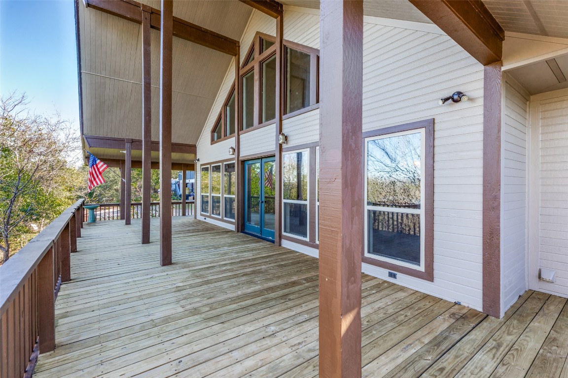 106 Redbud Drive Spicewood, TX 78669 - Photo 22 of 35 a view of dining room and wooden deck