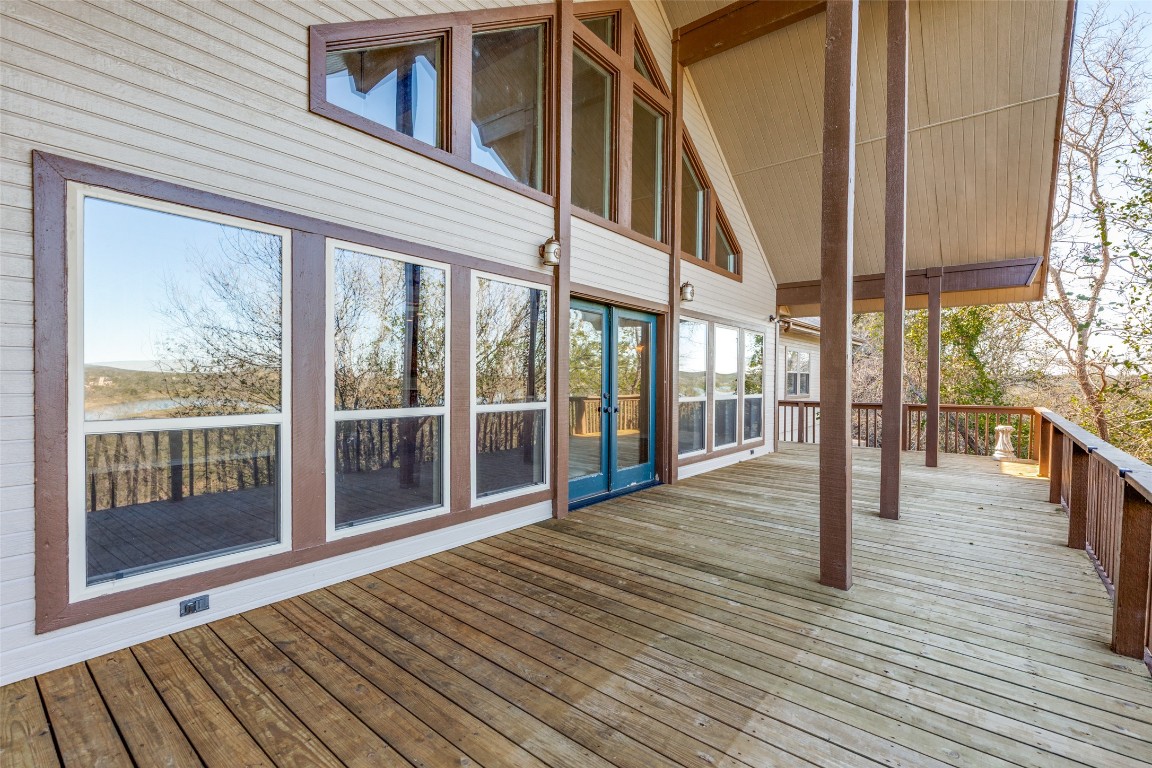 106 Redbud Drive Spicewood, TX 78669 - Photo 23 of 35 a view of outdoor space with wooden floor and windows