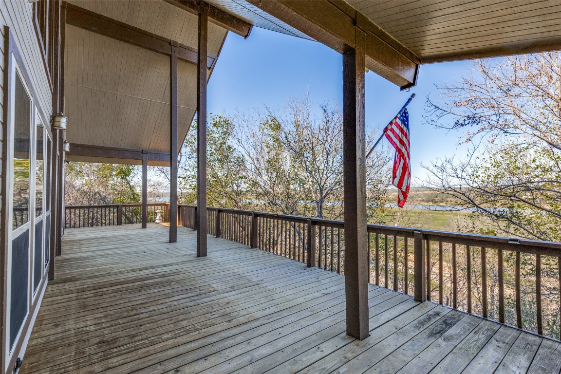 106 Redbud Drive Spicewood, TX 78669 - Photo 24 of 35 a view of a porch with wooden floor