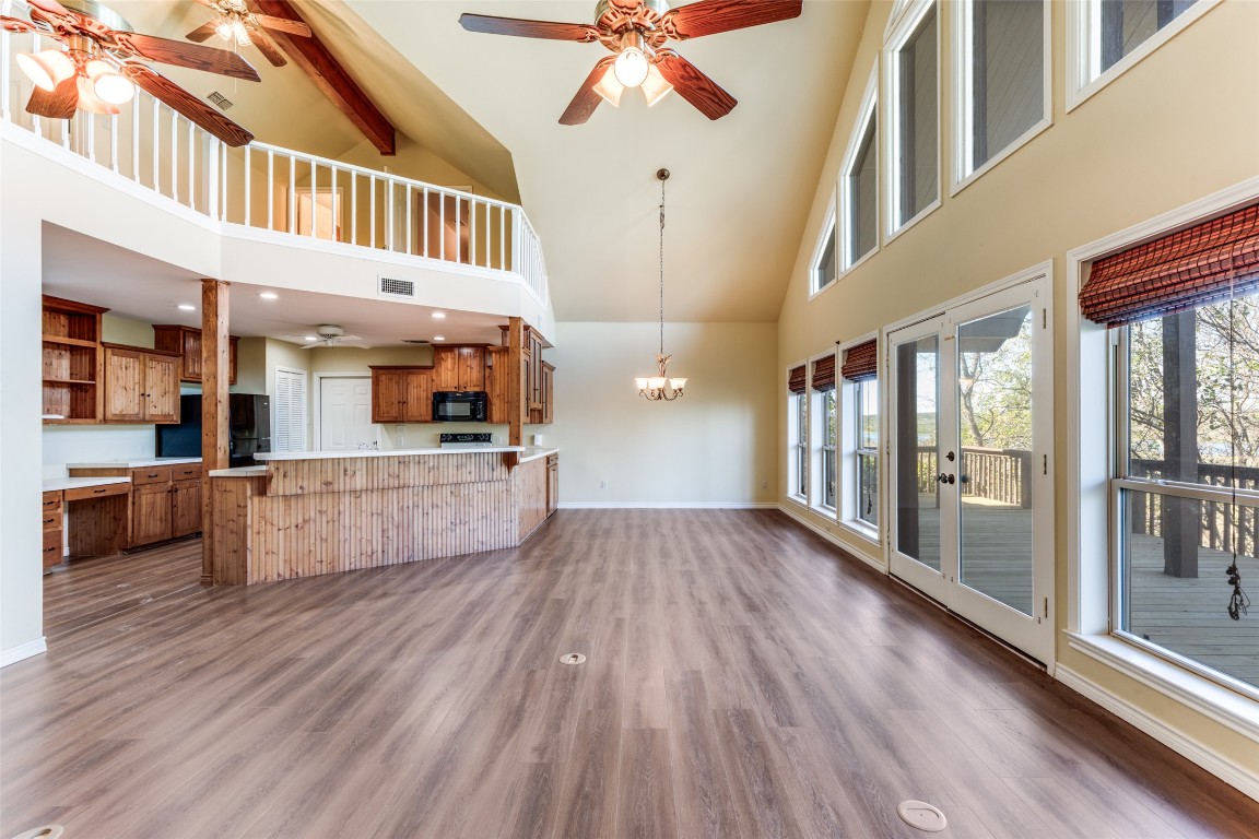 106 Redbud Drive Spicewood, TX 78669 - Photo 5 of 35 a view of a living room and wooden floor