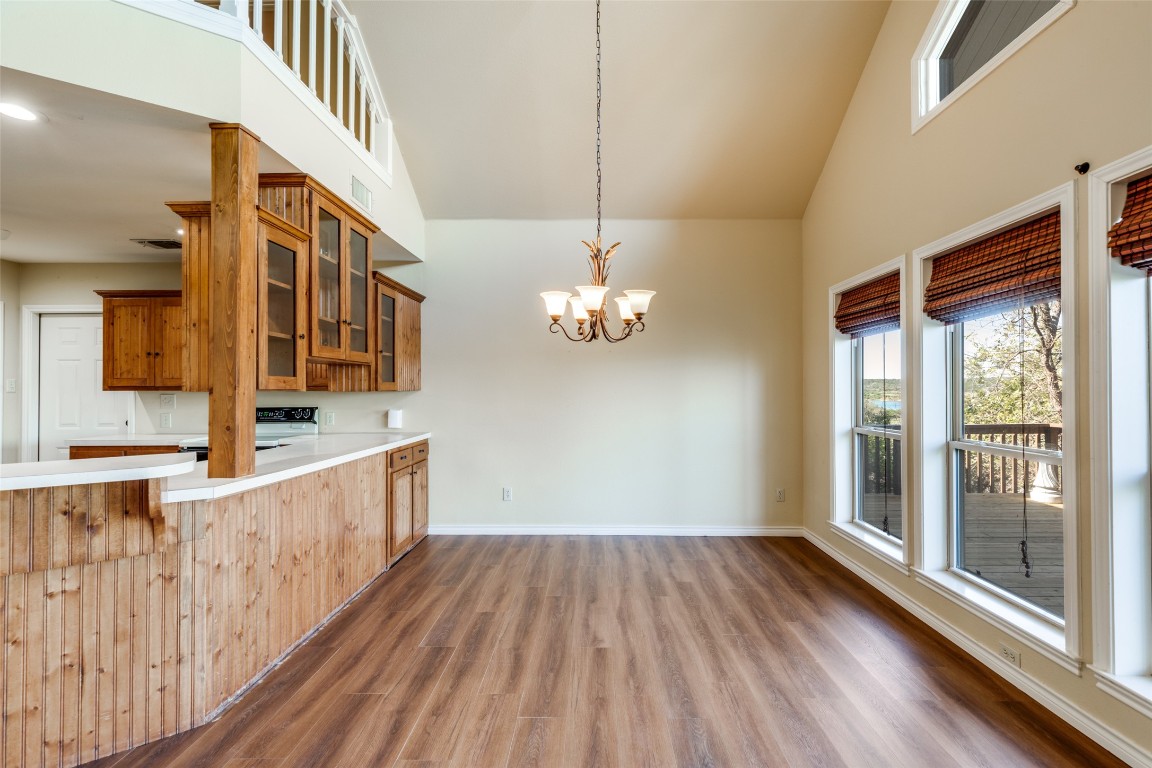 106 Redbud Drive Spicewood, TX 78669 - Photo 8 of 35 a view of a house with wooden floor