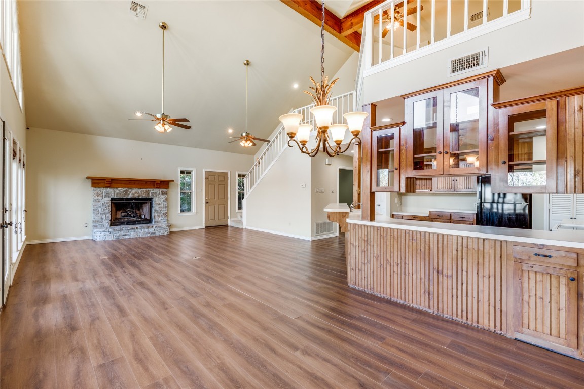 106 Redbud Drive Spicewood, TX 78669 - Photo 9 of 35 a view of a living room with furniture and a fireplace