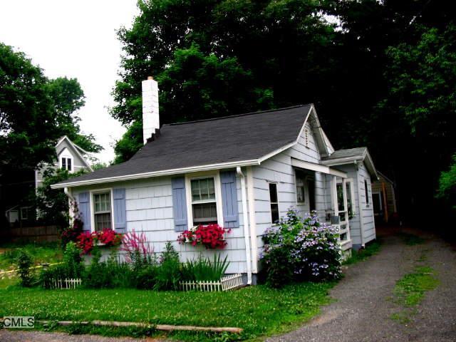 56 Roton Avenue Norwalk, CT 06853 - Photo 1 of 1 front view of a house with a yard