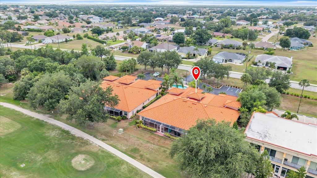 1260 Rio De Janeiro Avenue, Unit 102 Punta Gorda, FL 33983 - Photo 41 of 46 an aerial view of residential houses with outdoor space and trees