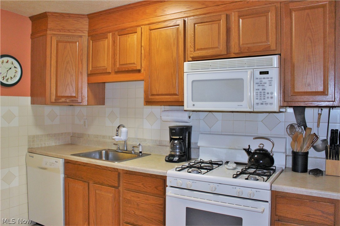 9674 Fairmount Road Novelty, OH 44072 - Photo 3 of 17 Updated Kitchen with oak cabinets and tile floor. Tile back splash.