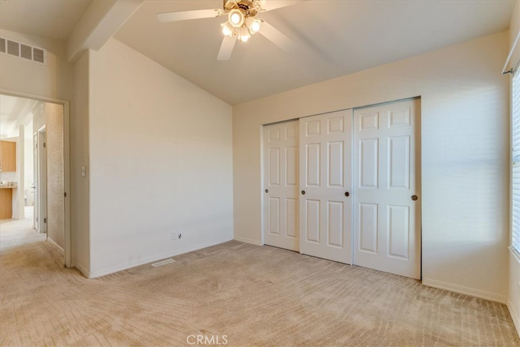 3210 Santa Maria Way, Unit 85 Santa Maria, CA 93455 - Photo 19 of 38 a view of an empty room and chandelier fan