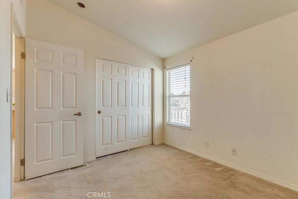 3210 Santa Maria Way, Unit 85 Santa Maria, CA 93455 - Photo 25 of 38 a view of an empty room with window and closet area