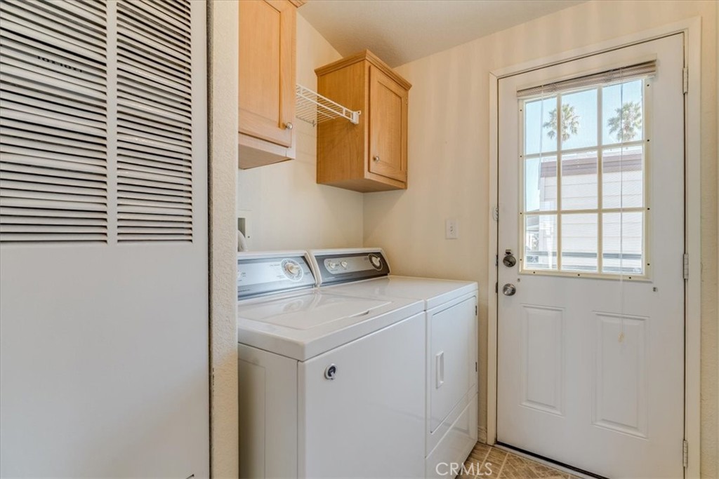 3210 Santa Maria Way, Unit 85 Santa Maria, CA 93455 - Photo 28 of 38 a utility room with a window dryer and washer
