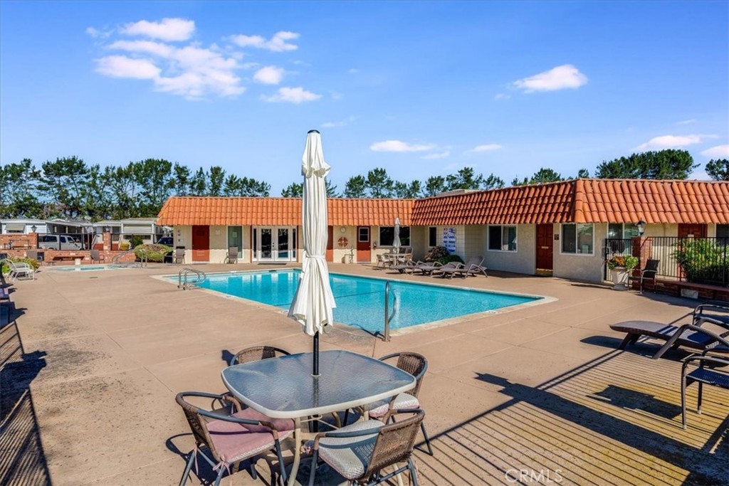 3210 Santa Maria Way, Unit 85 Santa Maria, CA 93455 - Photo 35 of 38 a swimming pool with outdoor seating and deck