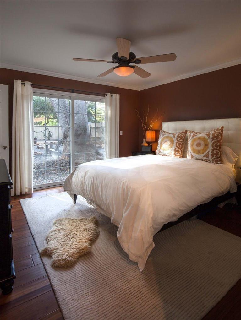 1025 South Rice Road Ojai, CA 93023 - Photo 4 of 17 a bedroom with a large bed and a large window