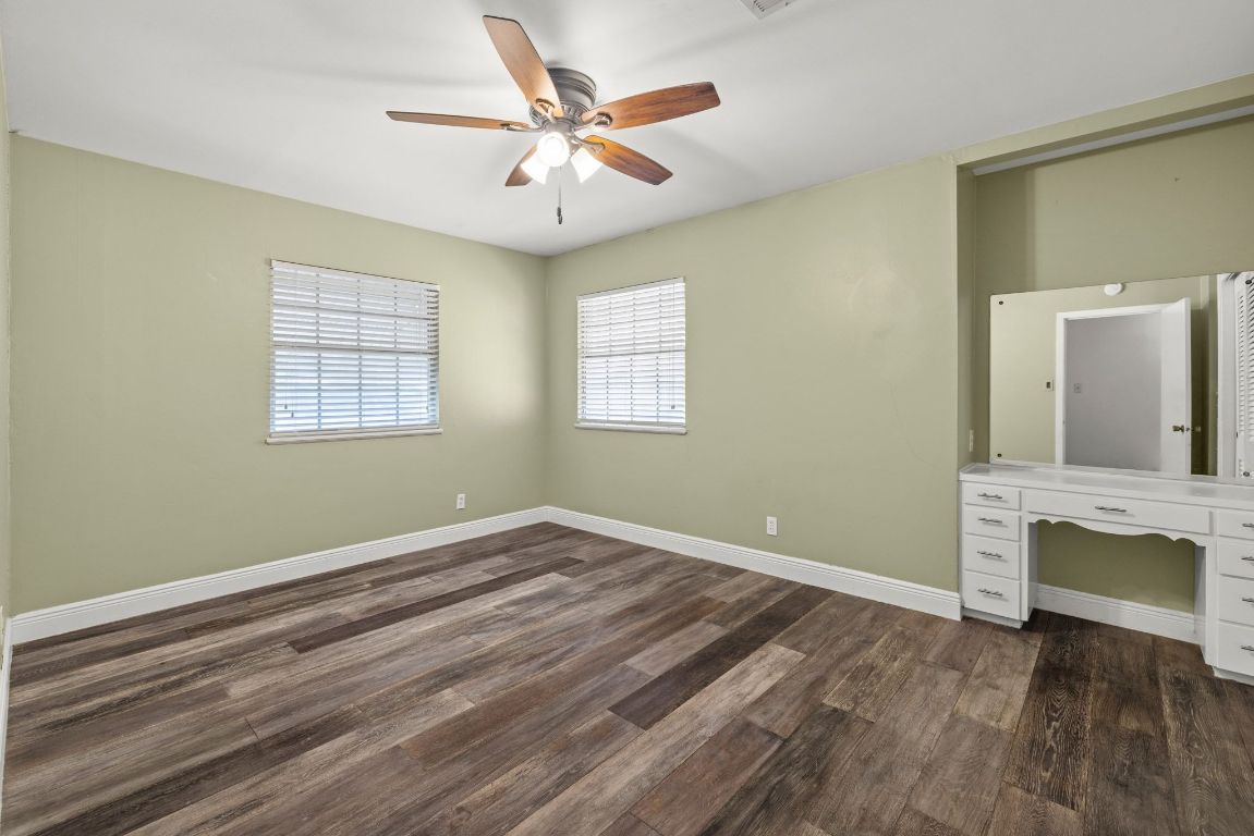 2326 Hartford Road Austin, TX 78703 - Photo 19 of 28 wooden floor in an empty room with a window