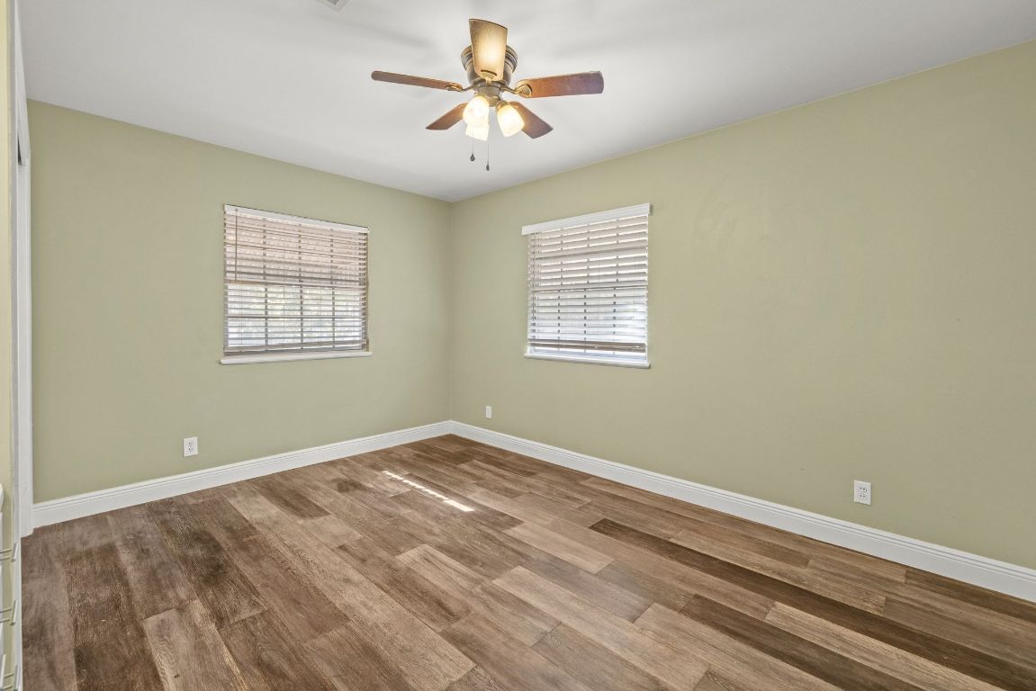 2326 Hartford Road Austin, TX 78703 - Photo 21 of 28 an empty room with windows and fan
