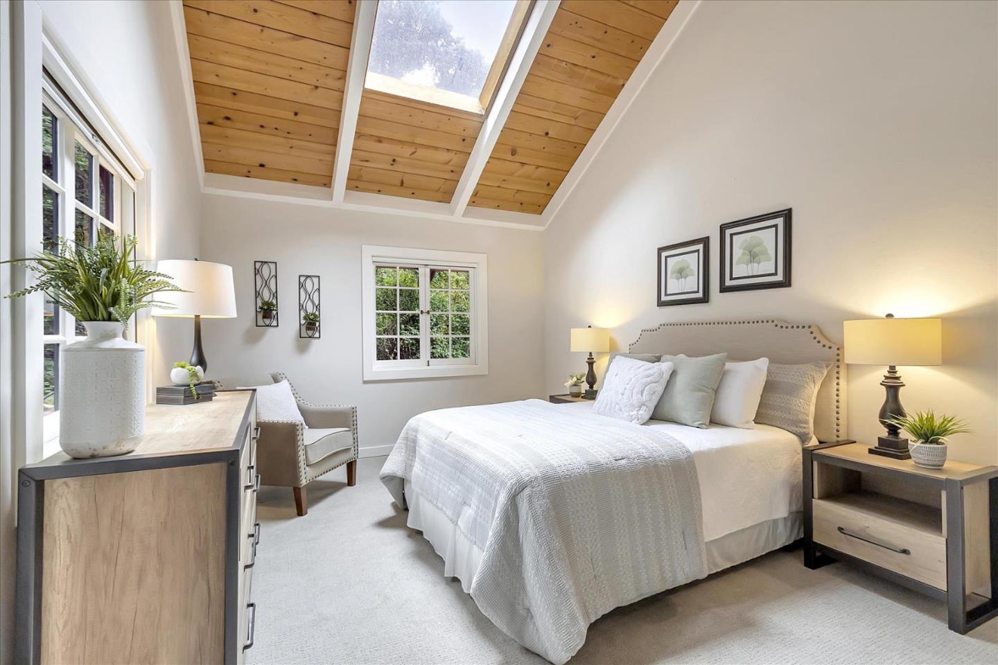 303 Midway Ranch Road Boulder Creek, CA 95006 - Photo 19 of 32 a bedroom with a bed and a potted plant