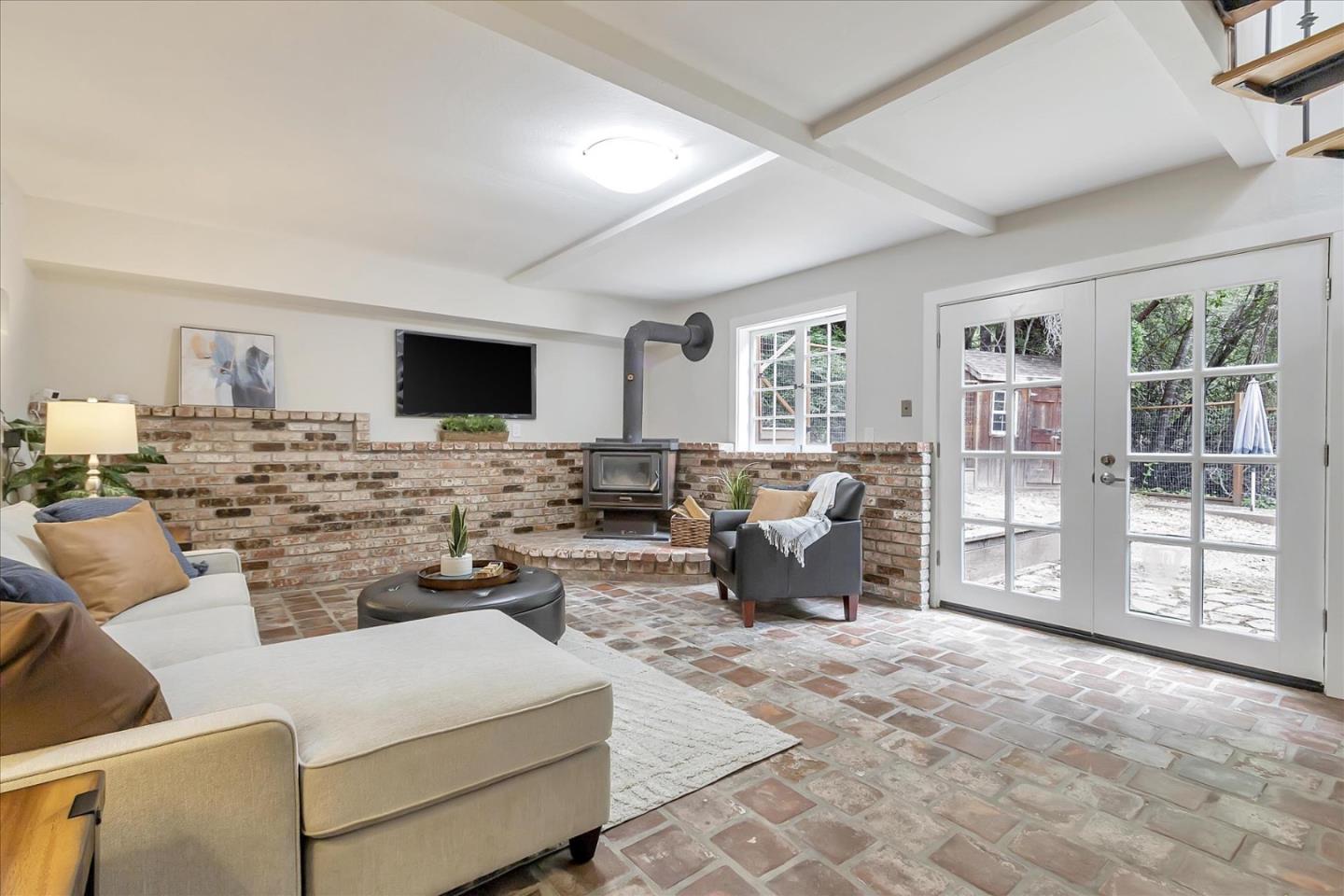 303 Midway Ranch Road Boulder Creek, CA 95006 - Photo 23 of 32 a living room with furniture large window and flat screen tv