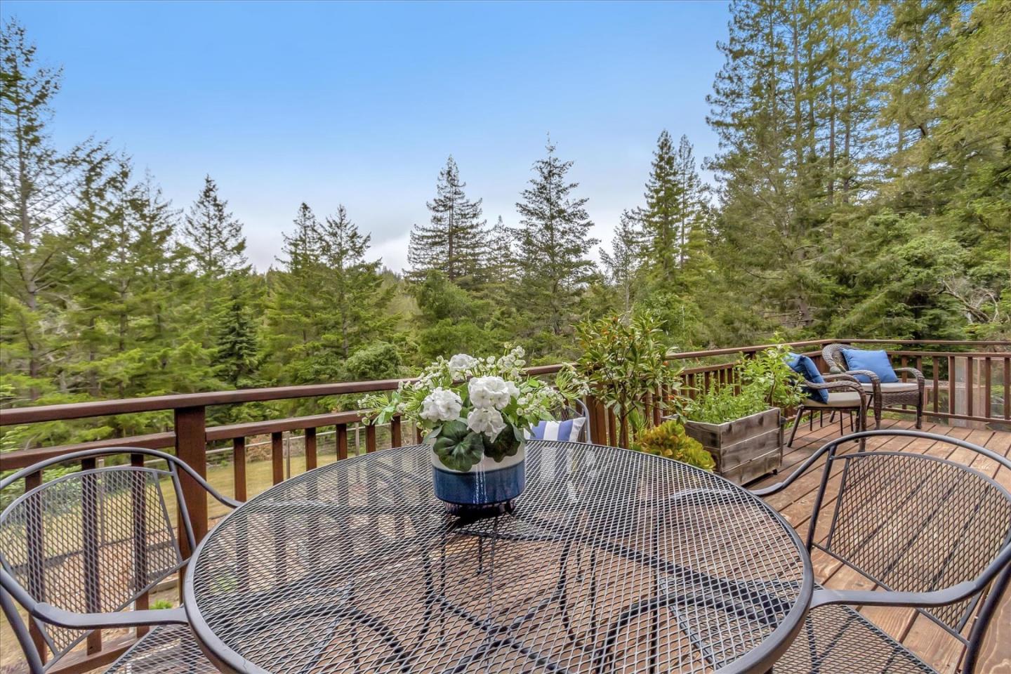 303 Midway Ranch Road Boulder Creek, CA 95006 - Photo 3 of 32 a view of a chairs and table in the balcony