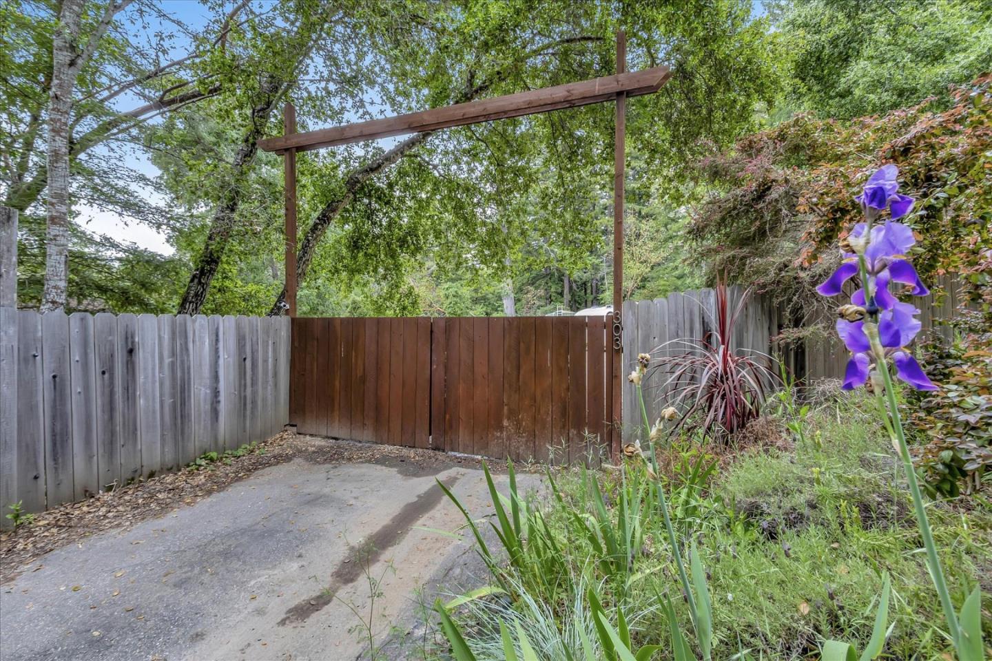 303 Midway Ranch Road Boulder Creek, CA 95006 - Photo 32 of 32 a backyard of a house with lots of green space