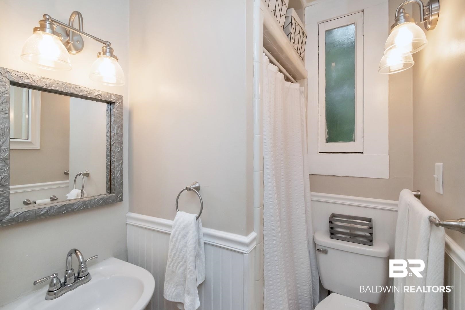 1305 Brown Street Mobile, AL 36604 - Photo 18 of 37 Bathroom with toilet, sink, and a shower with curtain