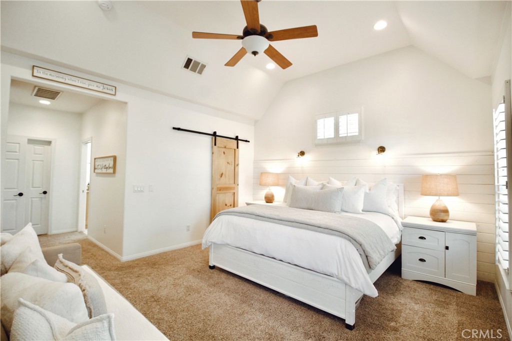 35159 El Dorado Road Lake Elsinore, CA 92530 - Photo 20 of 72 a bedroom with a bed and a chandelier fan