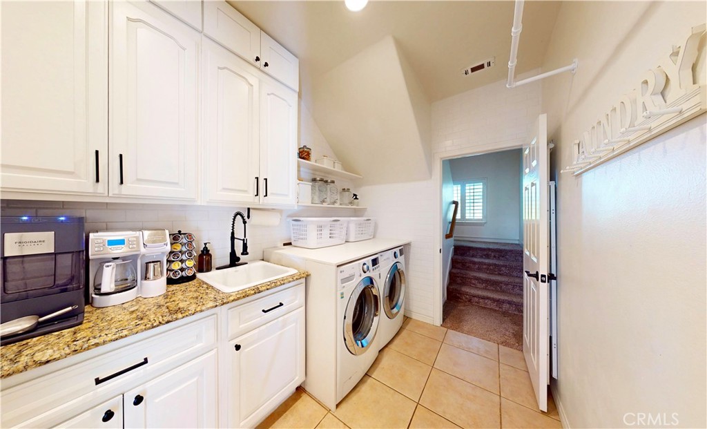 35159 El Dorado Road Lake Elsinore, CA 92530 - Photo 30 of 72 a kitchen with granite countertop a sink and cabinets