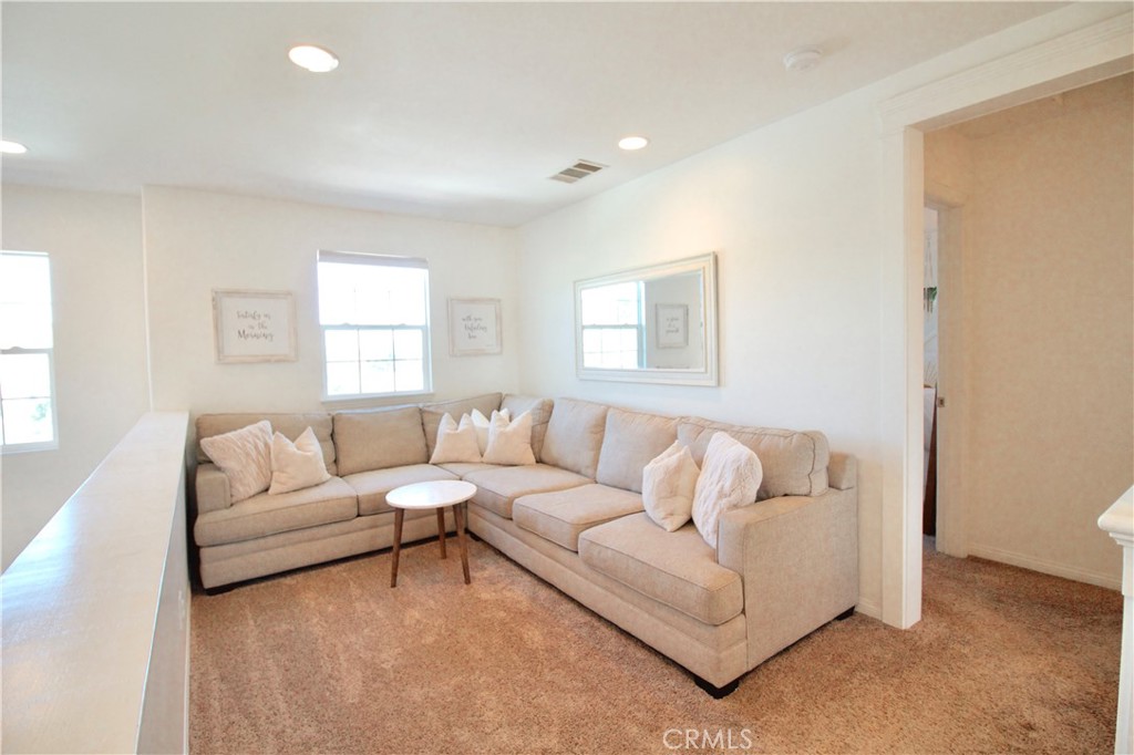 35159 El Dorado Road Lake Elsinore, CA 92530 - Photo 31 of 72 a living room with furniture and a large window