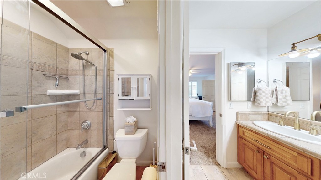 35159 El Dorado Road Lake Elsinore, CA 92530 - Photo 34 of 72 a bathroom with a granite countertop bathtub shower sink and toilet