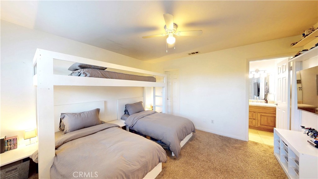 35159 El Dorado Road Lake Elsinore, CA 92530 - Photo 36 of 72 a bedroom with bed and wooden floor