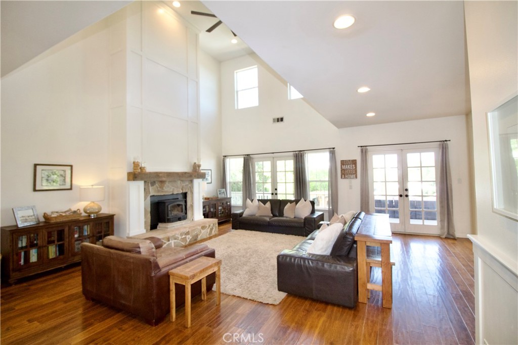 35159 El Dorado Road Lake Elsinore, CA 92530 - Photo 9 of 72 a living room with fireplace furniture and a wooden floor