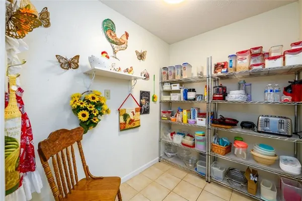 a cabinet with a book shelf and a couch