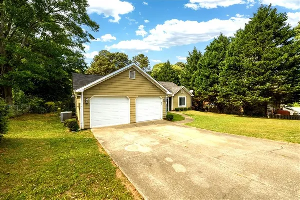 a front view of the house with yard