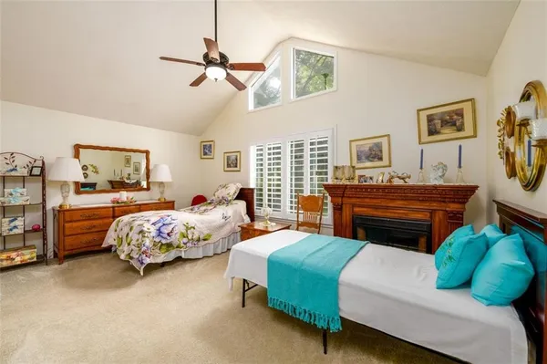 a bedroom with bed and window