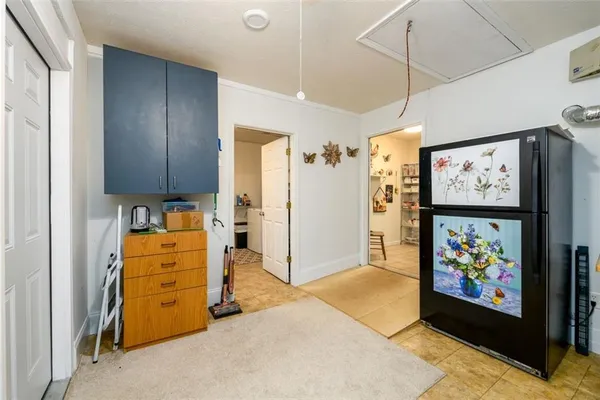 a view of walk in closet with furniture and a window