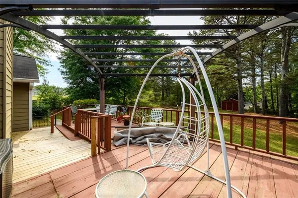 a view of swimming pool with seating area