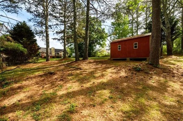 a backyard of a house with lots of green space
