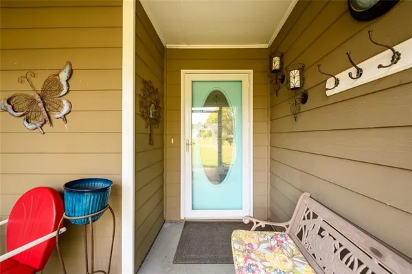 a view of an entryway with wooden floor