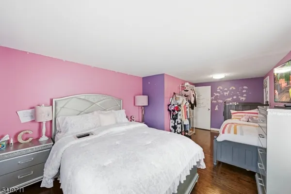 a bedroom with a bed and a closet