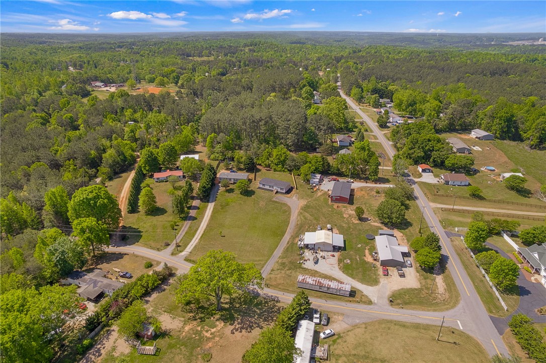 375 Griggs Road Six Mile, SC 29682 - Photo 36 of 36 Observe this expansive rural landscape with scattered homes amidst lush greenery and winding roads.