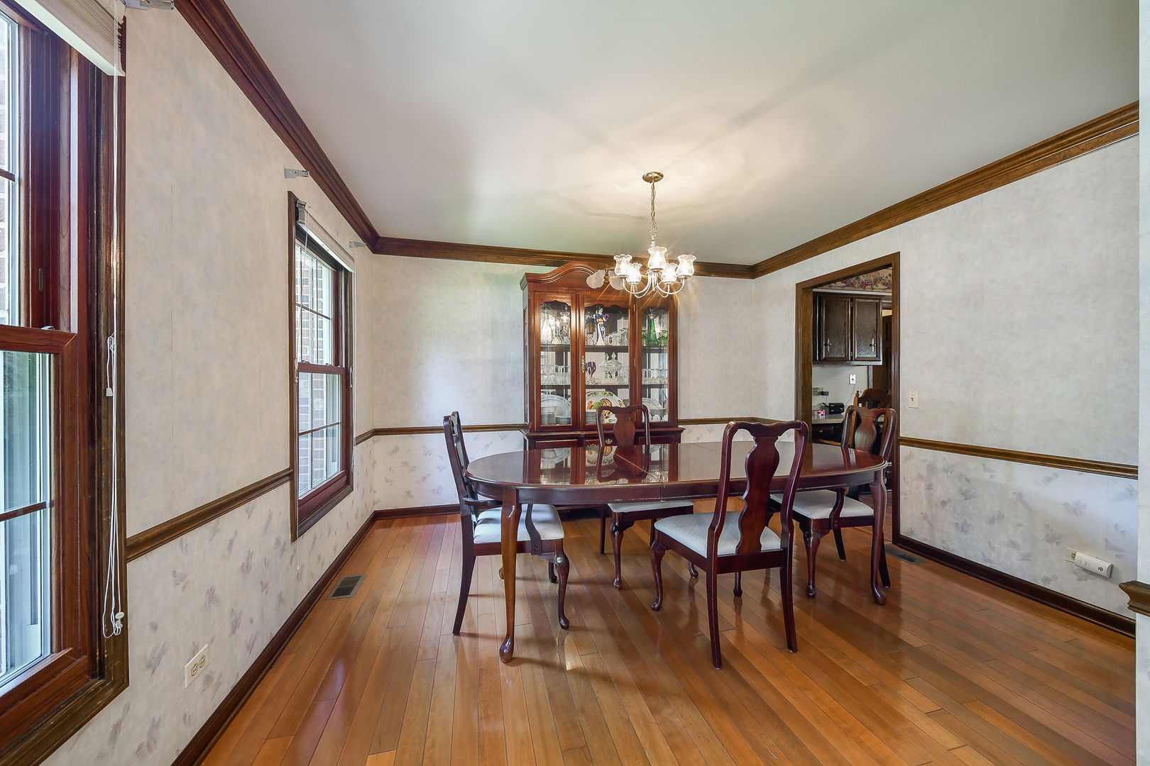 516 Cassin Road Naperville, IL 60565 - Photo 4 of 23 a view of a dining room with furniture and wooden floor