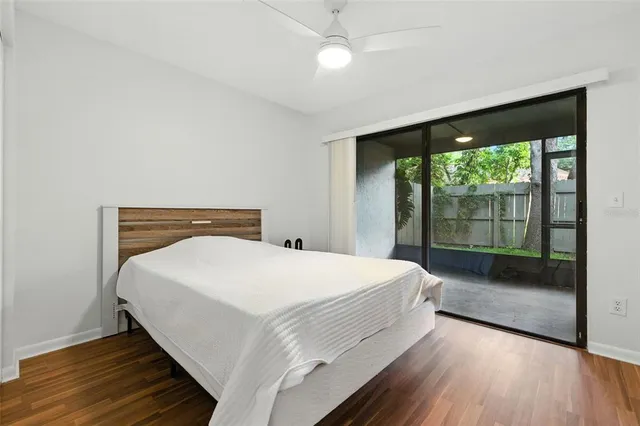 a bedroom with a large bed and a large window